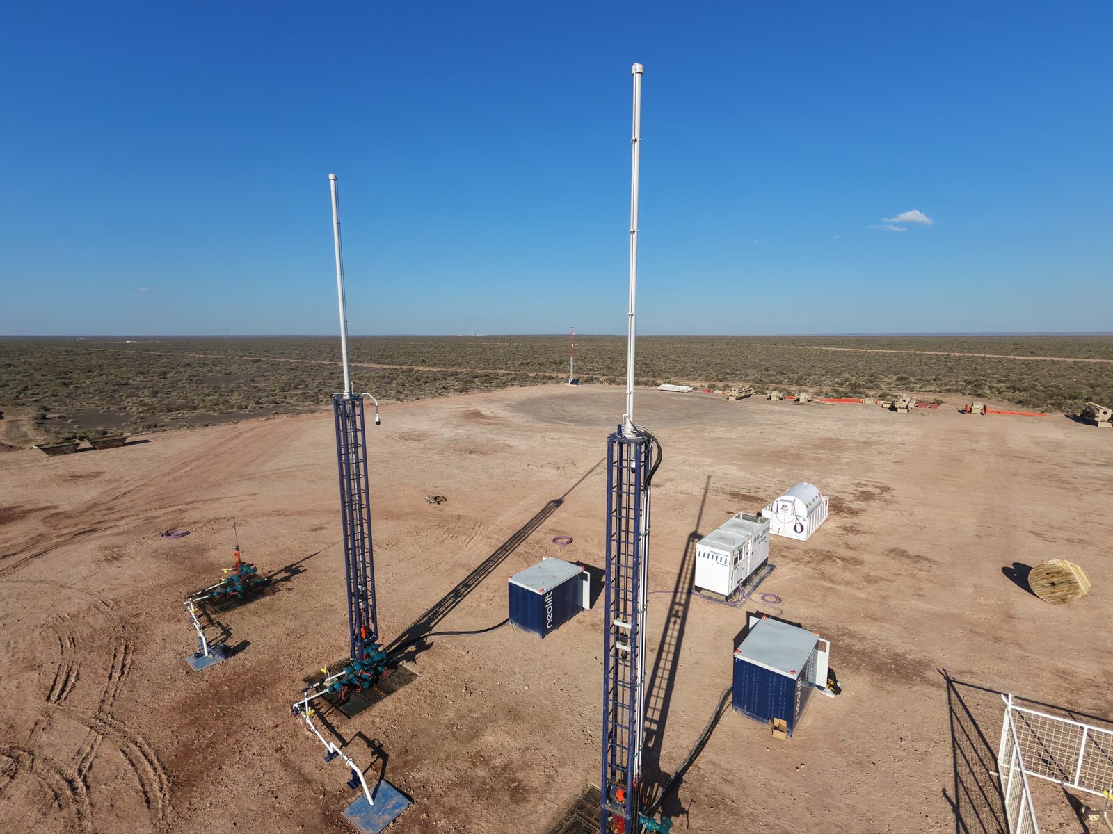 Two Neolift units producing on the same pad in Vaca Muerta, seen from the air: no concrete foundations and minimal surface footprint
